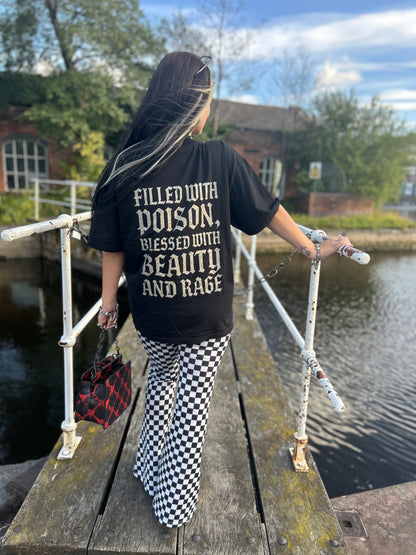 Full back view of ANG3L “Poison & Beauty” Oversized Gothic Tee with distressed gothic lettering on oversized fit.